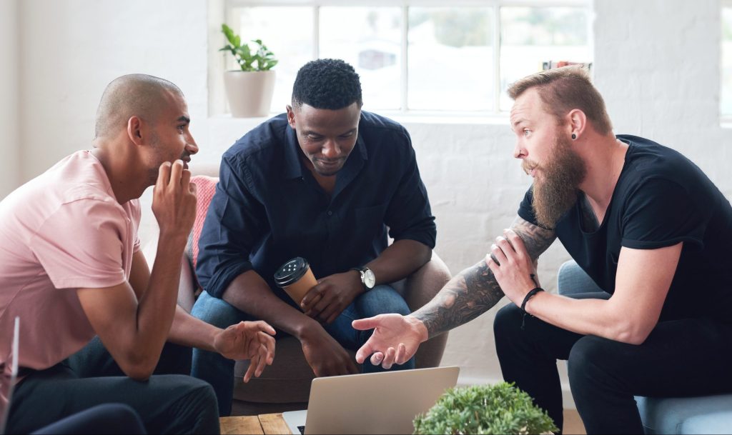 Three men talking about Mental Health.